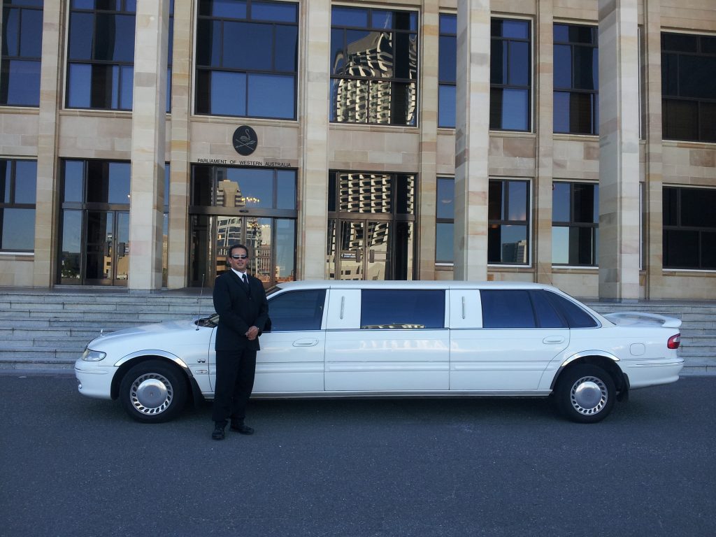 driver standing with a limo for Contact us page